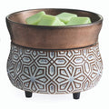 Bronze geometric fragrance warmer featuring a removable dish and green wax melts on display.
