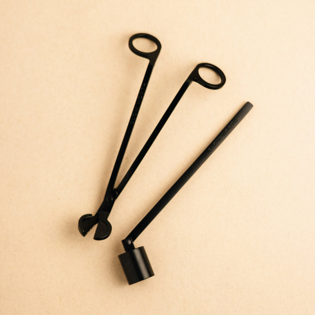 Candle care tool set featuring wick trimmer, snuffer, and dipper for optimal candle maintenance.