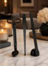 Phoenix Crafted Candle Care Set including trimmer, snuffer and wick dipper on a marble surface.