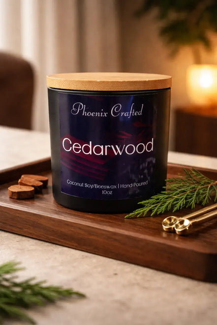 Black jar with a navy label and light lid on a tray with a pine sprig, round slices and small scoops.