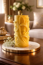Decorative Cedarwood Candles displayed on a marble tray in a cozy living room with floral decor.