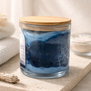 Clean Linen Candle in a clear jar with a wooden lid, showcasing a fresh and airy scent for a calming atmosphere.