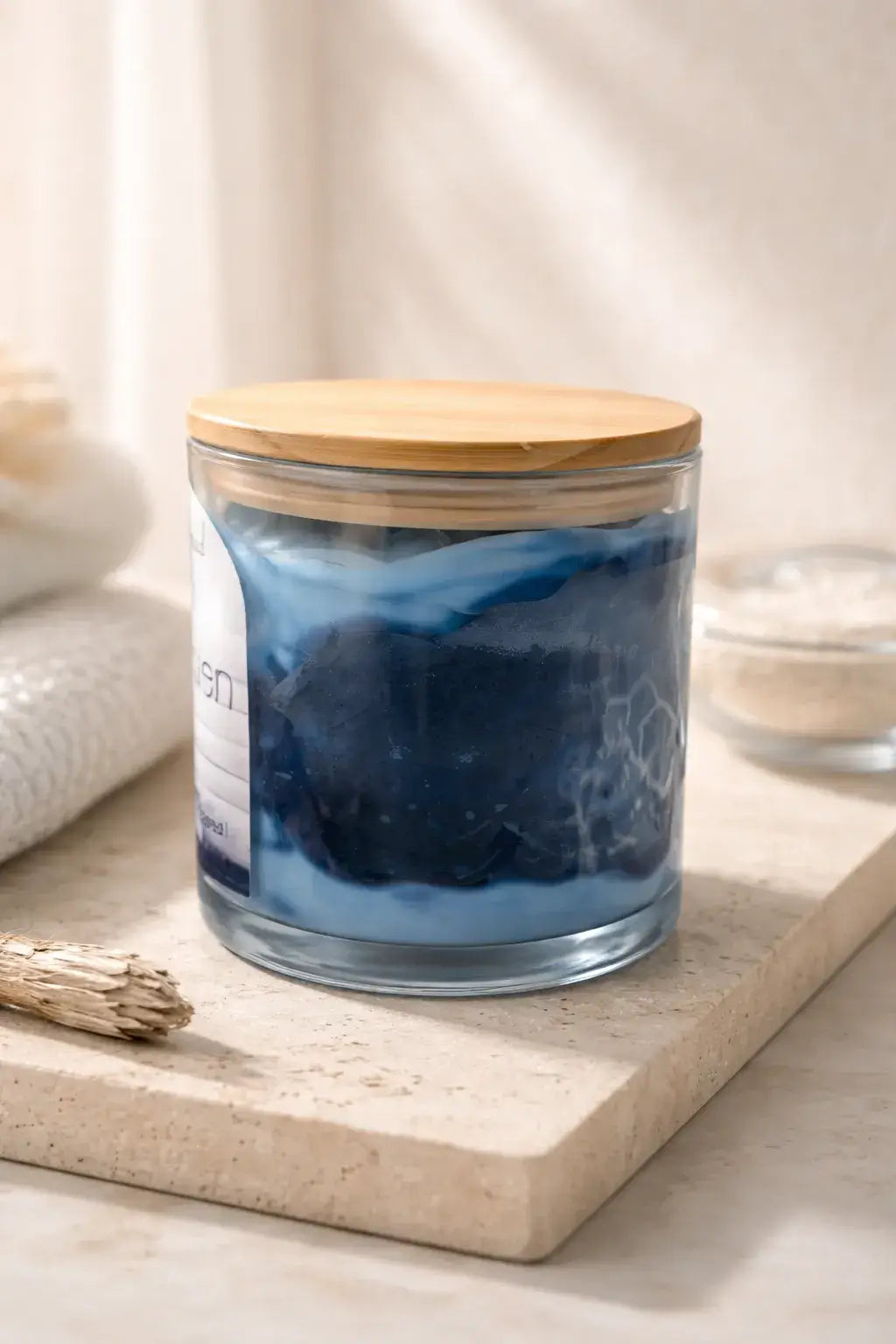 Clean Linen Candle in a clear jar with a wooden lid, showcasing a fresh and airy scent for a calming atmosphere.