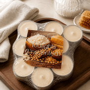 Wrapped pack of unscented tealights with cotton wicks on a wooden tray beside a coconut-and-honeycomb product card.