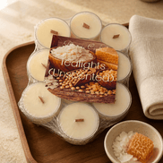 Wrapped pack of unscented tealights with short wood wicks on a wooden tray beside a honeycomb and coconut-themed card.