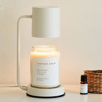 Modern Dimmable Candle Warmer Lamp placed above a cotton soap scented candle, showcasing a contemporary design.