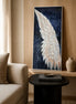 Emberwing Diamond Painting featuring a radiant wing with warm colors under soft lighting.