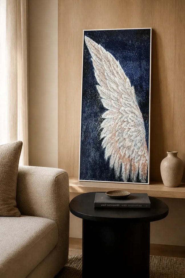 Emberwing Diamond Painting featuring a radiant wing with warm colors under soft lighting.