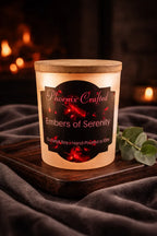 Embers of Serenity Candle in a decorative container with a artisan label, set against a warm, glowing background.