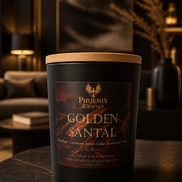 Golden Santal candle in a Phoenix Crafted vessel with warm amber and sandalwood styling.