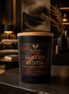Golden Santal candle in a Phoenix Crafted vessel with warm amber and sandalwood styling.