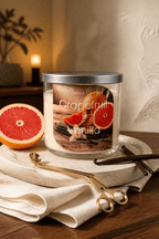 Grapefruit & Vanilla Candle in a stylish setting, featuring grapefruit slices, showcasing grapefruit vanilla scented candle.