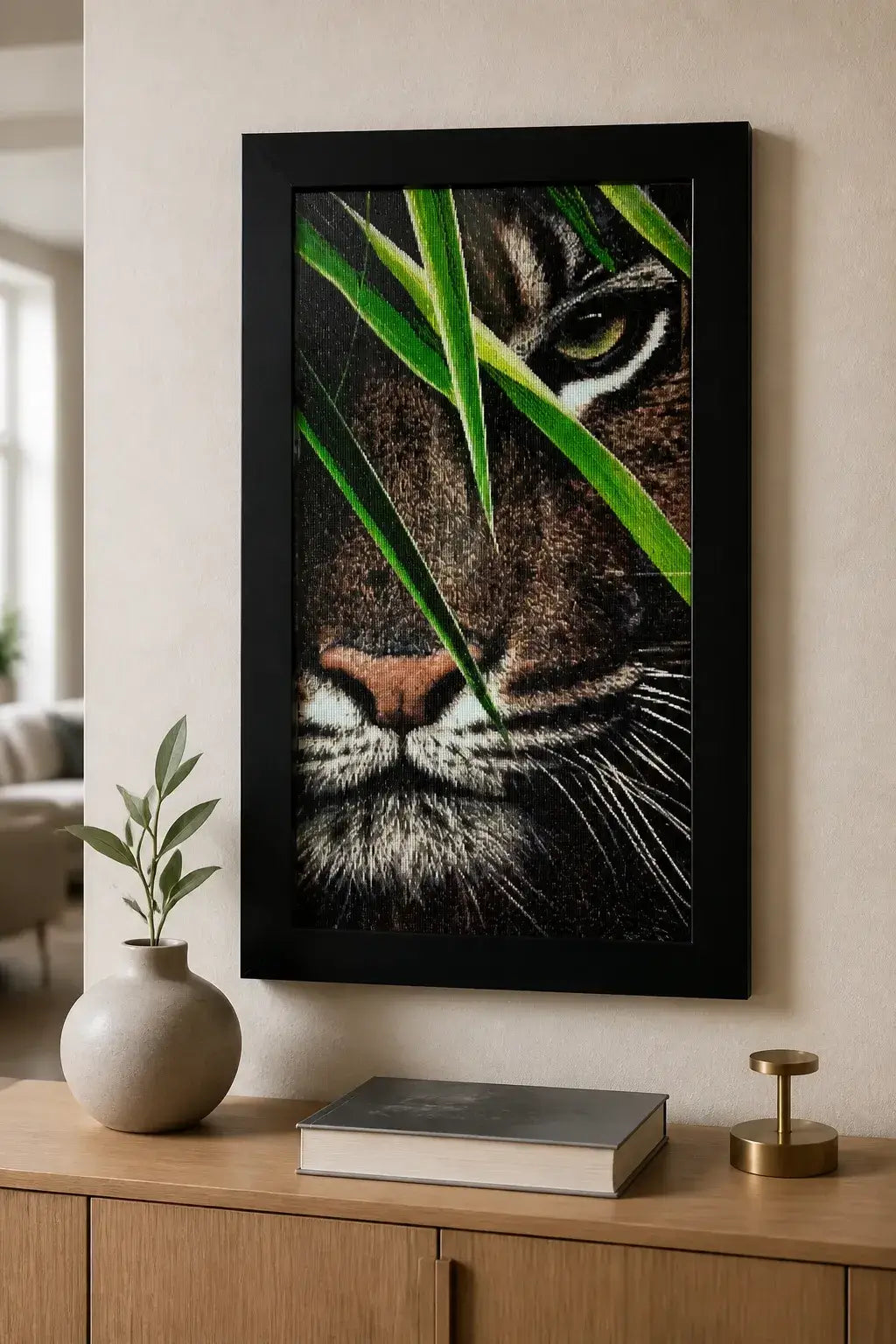 Hidden Tiger Diamond Painting displayed in a black frame, featuring a close-up of a tiger's face with vibrant details.