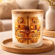 Frosted glass jar candle with flat wooden lid and visible 