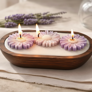 Lavender candle trio with floral designs, hand-poured in a wooden container, perfect for relaxation.