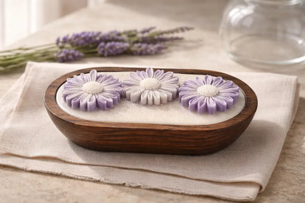 Lavender Candle with lavender flowers in a wooden dish, creating a serene and calming atmosphere for relaxation.