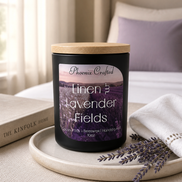 Linen & Lavender Fields Candle by Phoenix Crafted displayed on a tray with a soft cloth and lavender sprigs.