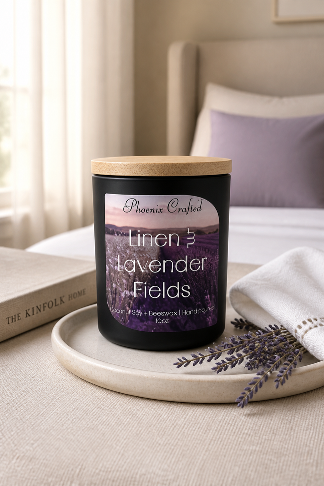 Linen & Lavender Fields Candle by Phoenix Crafted displayed on a tray with a soft cloth and lavender sprigs.