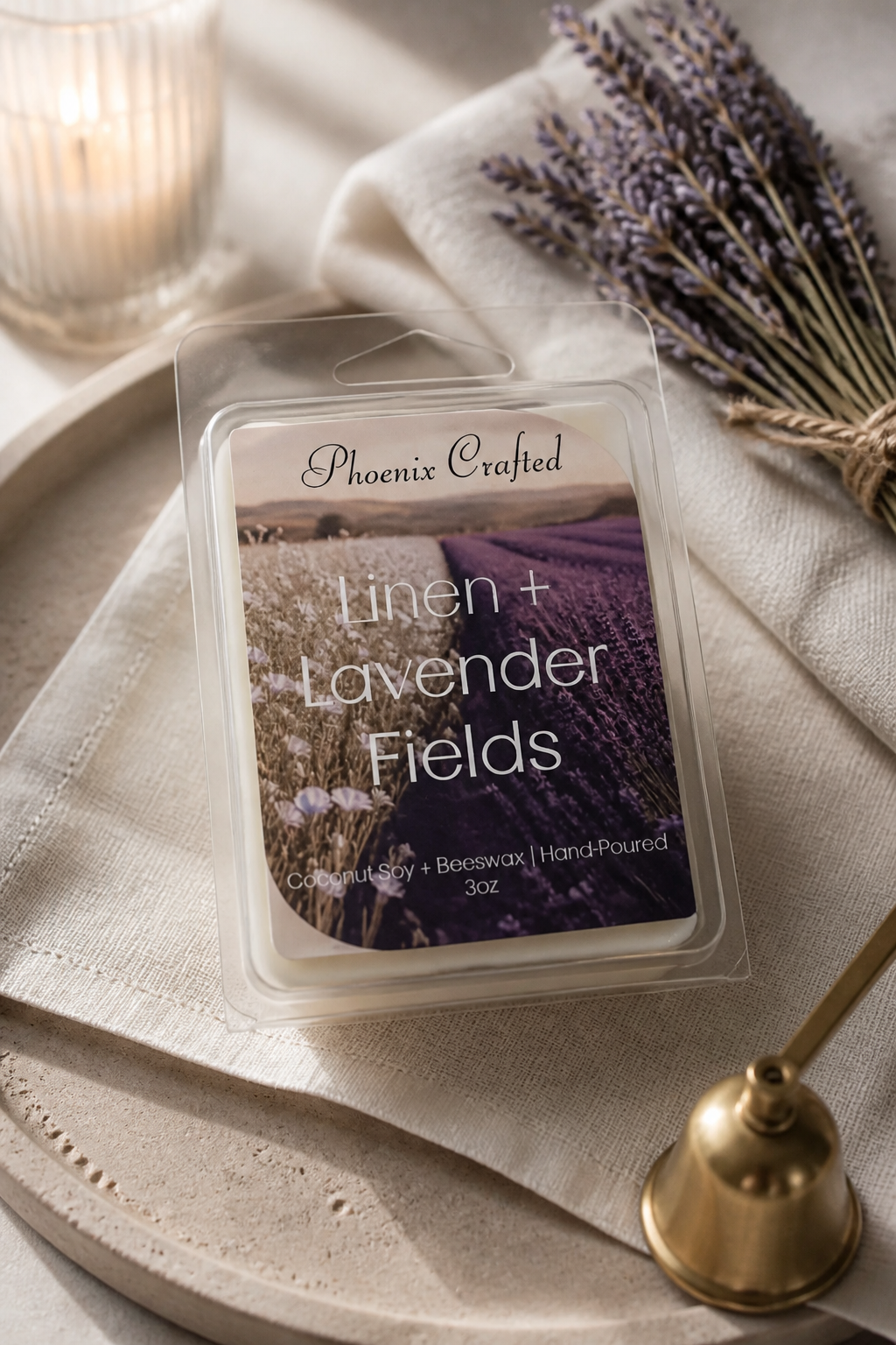 Linen & Lavender Fields Wax Melts packaging on a wooden tray with lavender flowers and a candle