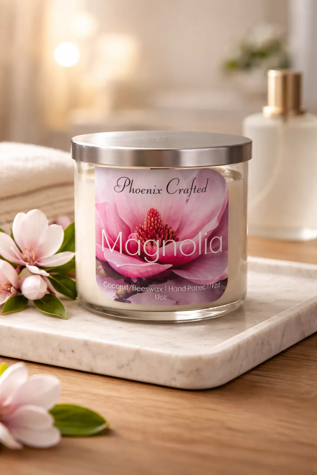 Magnolia Candle in a glass jar, featuring soft floral design and elegant silver lid, perfect for tranquil atmospheres.