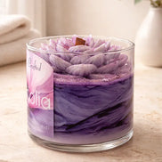Magnolia Candle in a glass jar featuring a floral design with purple hues and elegant textures.