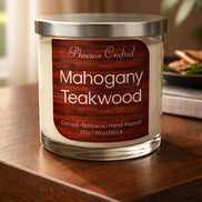 Clear glass jar candle with silver metal lid and cream wax; wood-grain label reading 