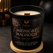 Open Midnight Magnolia candle in a matte black jar with a wooden wick on a wood coaster.