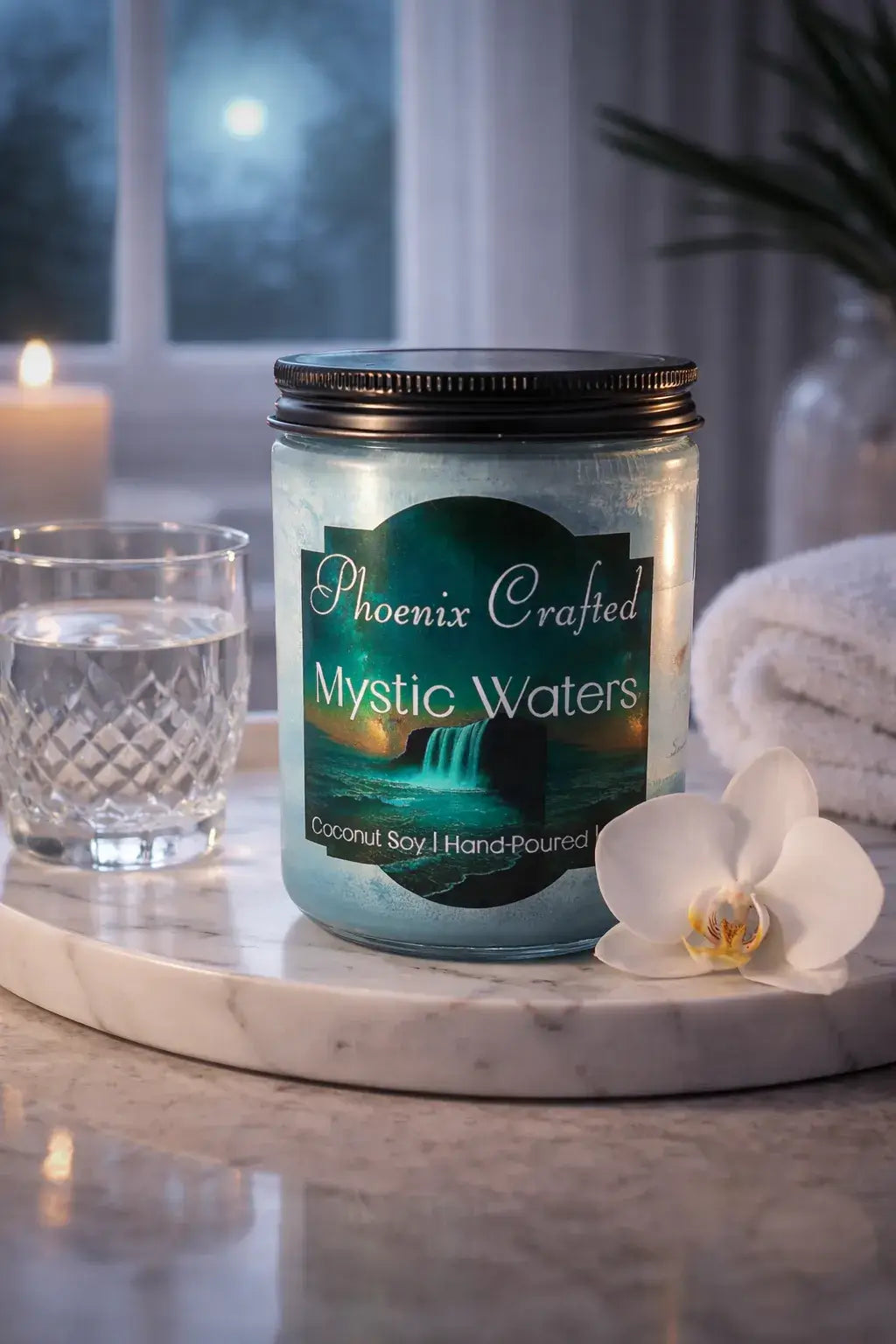 Phoenix Crafted Mystic Waters Candle in a serene setting with glass of water and white orchid.