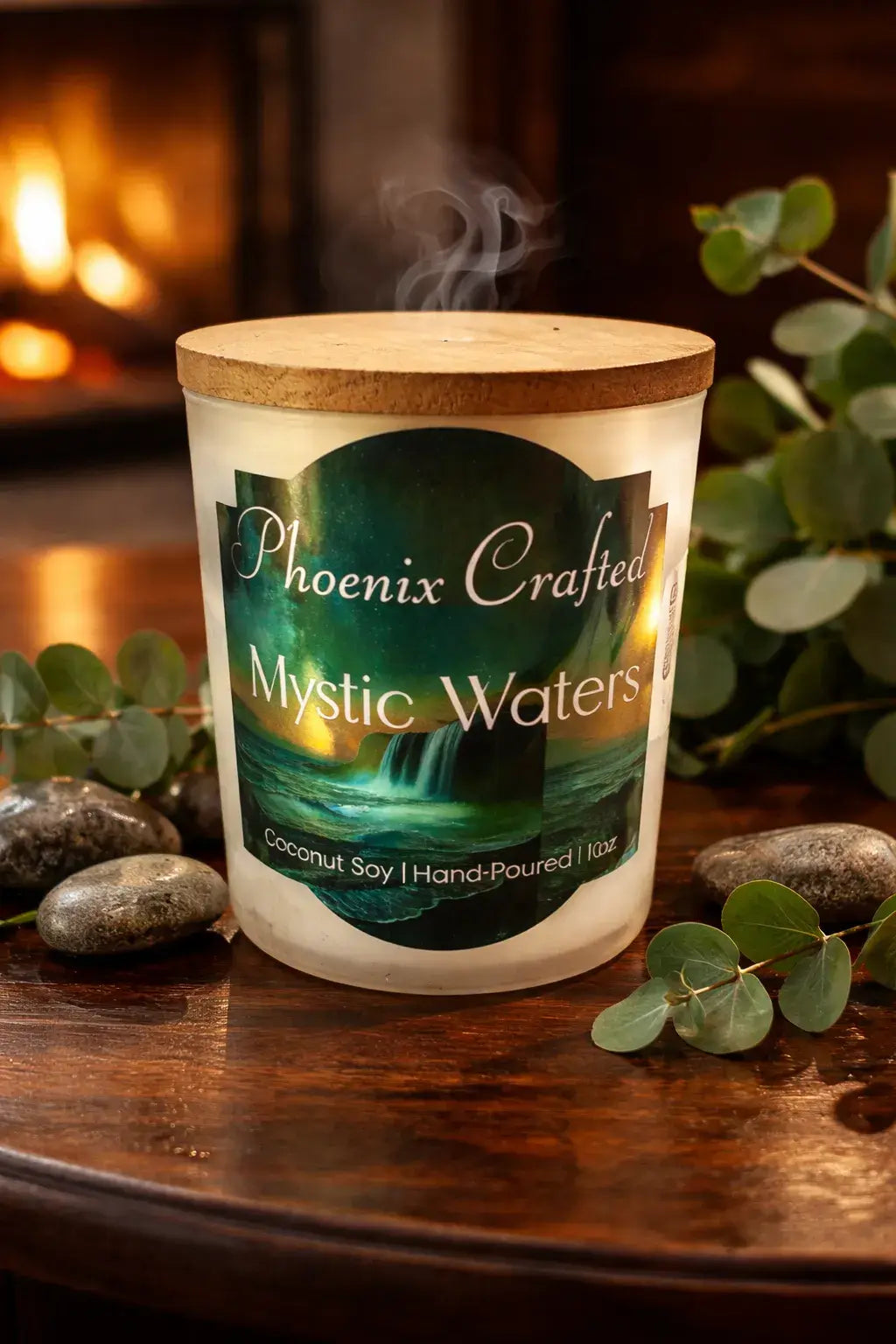 Mystic Waters Candle with a wooden lid, hand-poured coconut soy, surrounded by greenery and stones, burning softly.