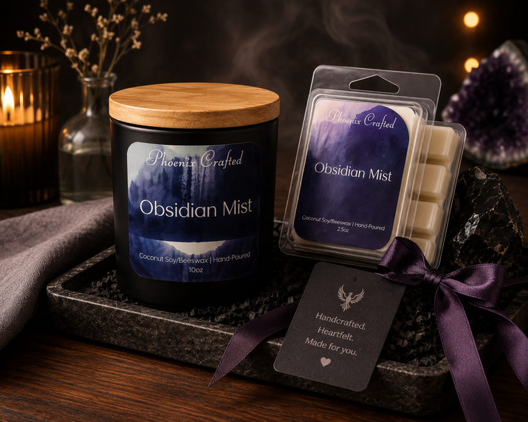 Obsidian Mist candle and matching wax melts arranged together as a coordinated Phoenix Crafted gift set.