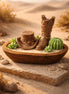 Palo Santo Cedarwood & Patchouli Candle Decorative holder featuring a cowboy boot and hat with succulents in a rustic setting.