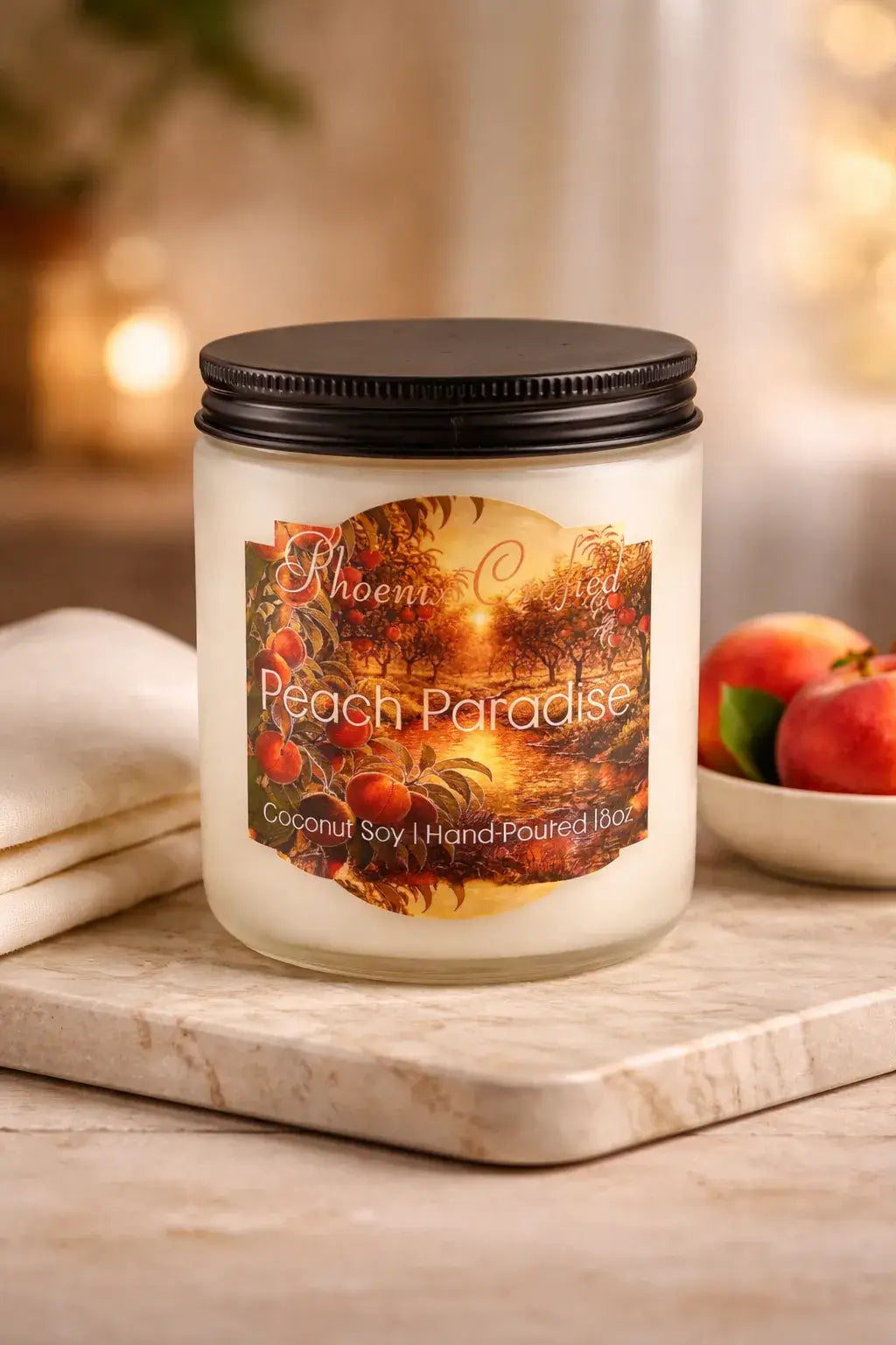 Peach Paradise candle in a clear glass jar with a black lid on marble beside fresh peaches.