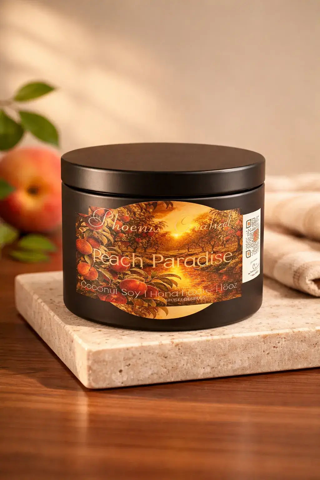 Peach Paradise Candle in a black jar on a marble surface, with warm sunlight and autumn-themed design.