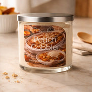 Clear glass jar candle with silver lid and pale cream wax; front label reads 
