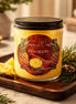 Pineapple & Cedarwood Candle in a glass jar with pineapple slices and pine greenery on a wooden tray.
