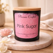 Black Pink Sugar candle jar with a wooden lid and pink Phoenix Crafted label.