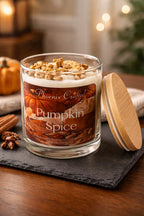 Pumpkin Spice Candle in a glass jar with wooden lid, featuring creamy pumpkin and spices for a cozy autumn vibe.
