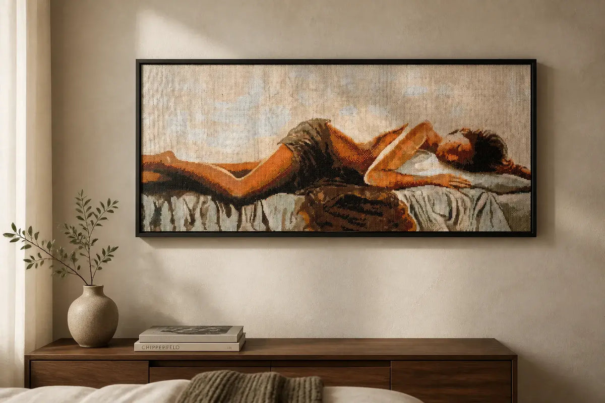 Resting Grace completed diamond painting of a serene reclining figure in warm beige, cream, brown, blush, and gold tones.