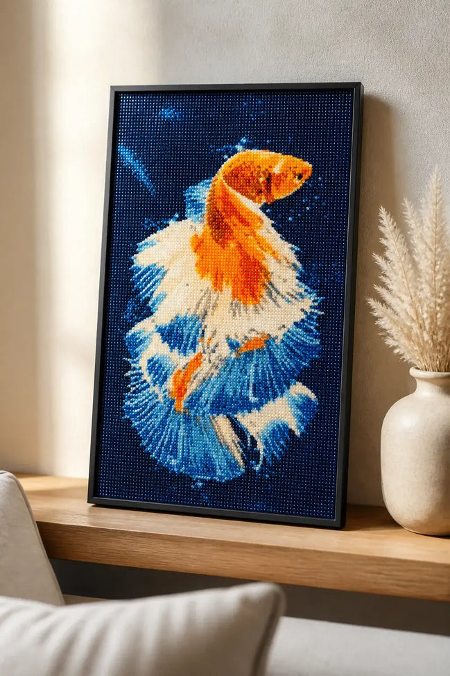 Sapphire Ember Betta finished diamond artwork shown in a styled frame mockup; artwork is sold unframed.