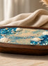 Sea Salt & Rosemary Candle displayed in a wooden tray with shells and blue crystals, evoking a coastal vibe.