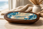 Sea Salt & Rosemary Candle displayed in a wooden tray with shells and blue crystals, evoking a coastal vibe.