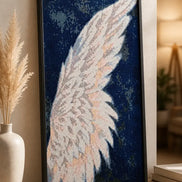 Seraphic Wing Diamond Painting featuring a radiant, luminous wing design against a dramatic backdrop.