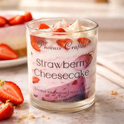 Strawberry Cheesecake Candle in a glass jar with fresh strawberries, ideal for cozy atmospheres and dessert lovers.