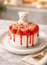 Strawberry Cheesecake Candle with a cute teddy bear and strawberries on top on a stylish platter.