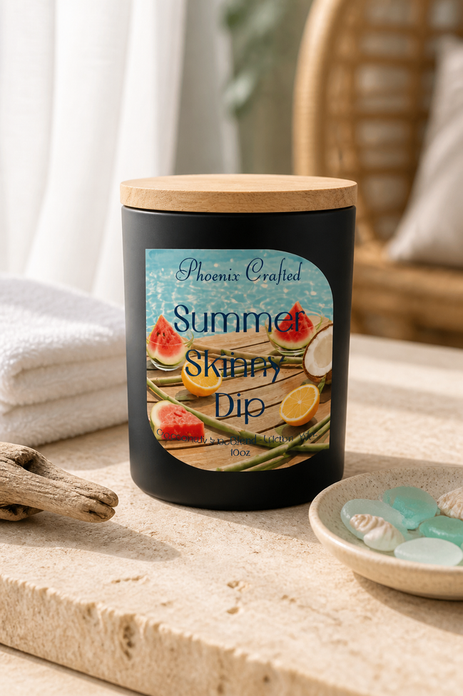 Summer Skinny Dip Candle on a stone surface with watermelon and lemon graphics, surrounded by seashells and beach decor.