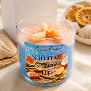 Image of Summer Skinny Dip Candle with tropical fruits, set against a beach background.