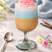 Tropical Sorbet decorative candle with colorful layered wax and whipped-style topping.