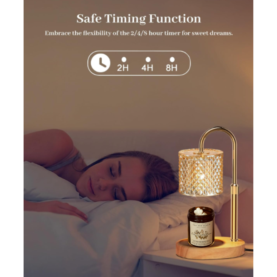 Brass curved lamp warmer with crystal-pattern shade over a round base holding an amber jar candle on a bedside table next to a sleeping woman.