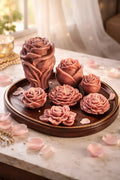 Elegant Vanilla Praline Decorative Candles in rose shapes on a wooden tray, ideal for warm, inviting atmospheres.