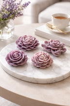 Elegant lavender floral decorative candles on a marble tray, designed to enhance cozy atmospheres.